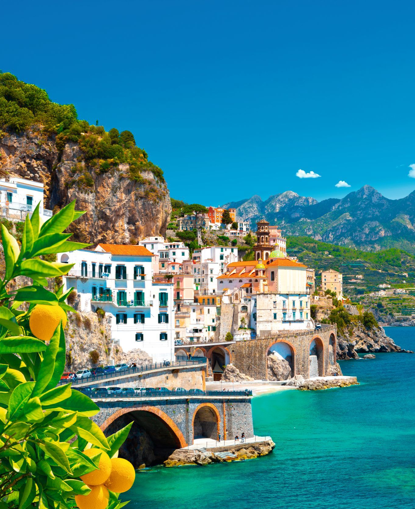 1356x1661_Beautiful view of Amalfi on the Mediterranean coast with lemons in the foreground, Italy. High quality photo